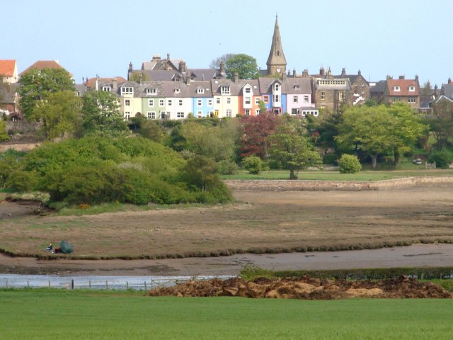 The iconic row of pastel-coloured houses along the harbour at Alnmouth, Northumberland